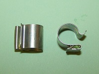 Edge cable/pipe clip for 10.9mm diameter pipe and 1.2mm panel thickness.  Mini overflow pipe.